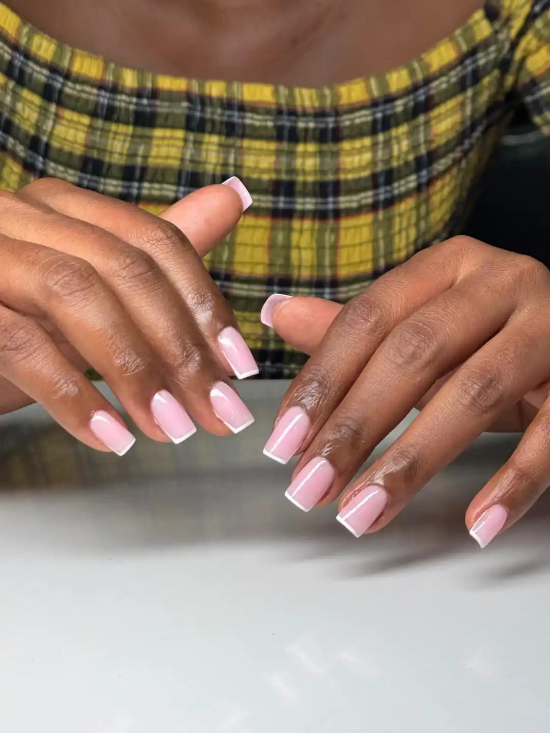 Soft pink square acrylic nails with a clean luxury finish